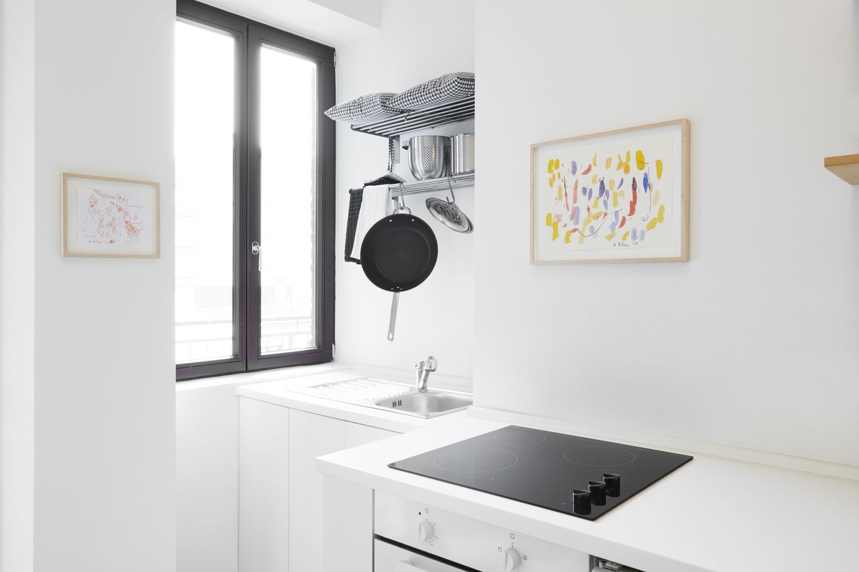 Installation View of 2 Multicolored Untitled Drawings from Butzer's Salon Nino Mier Exhibition (2018) in the Kitchen highlighting a yellow piece.