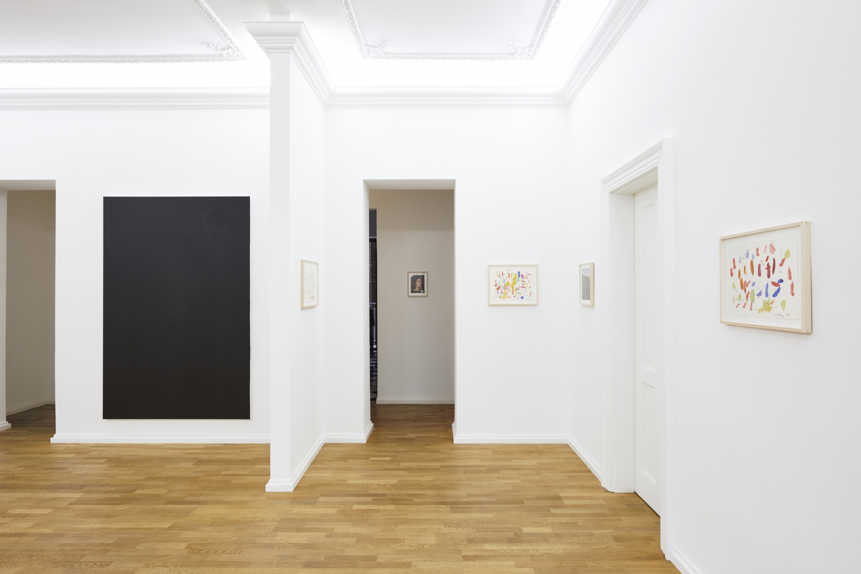 Installation View of 5 Multicolored Untitled Drawings from Butzer's Salon Nino Mier Exhibition (2018) and one Large Black Painting