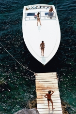 Slim Aarons, Speedboat Landing: A Magnum motorboat belonging to Count Filippo Theodoli arrives at the private jetty of the Il Pellicano Hotel in Porto Ercole, Italy, August 1973