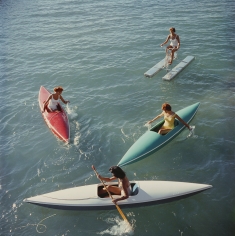 Slim Aarons, Lake Tahoe Trip, 1959: Young women canoeing on the Nevada side of Lake Tahoe