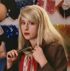 Abe Frajndlich, Cindy Sherman combing blond wig, Walker Street Studio, April, 1987