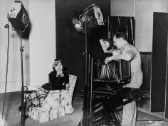 Virgil Apger, Clarence Sinclair Bull photographing Myrna Loy, 1934