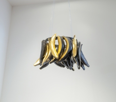 Simone Leigh "Skirt", 2015 Colored porcelain, gold leaf, steel, wire 11 x 15 x 13 inches