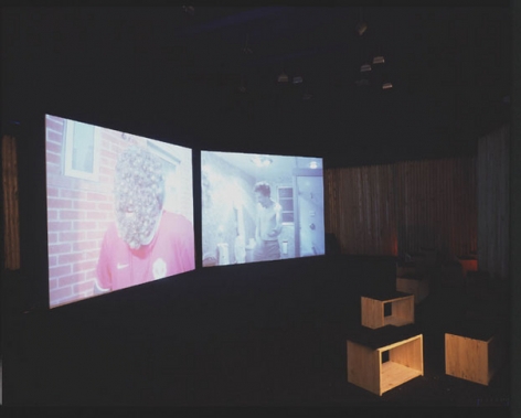 Installation view from "Home," 2003. Dual screen DVD shot with digital camera, 32 minutes. Edition of 5. MP V-7