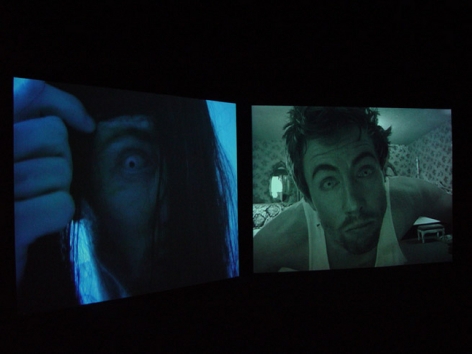 Installation view from "Home," 2003. Dual screen DVD shot with digital camera, 32 minutes. Edition of 5. MP V-7