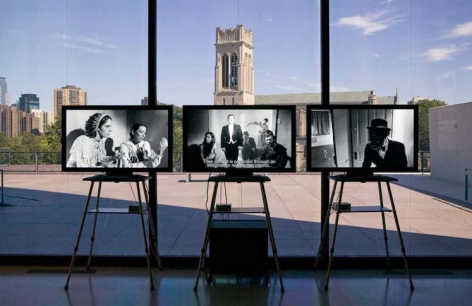 “Triangle of Need”, 2007. Eight channel installation, in collaboration with Sean Griffin, Dylan Skybrook and Kunle Afolayan. Installation view, Walker Art Center, Minneapolis.