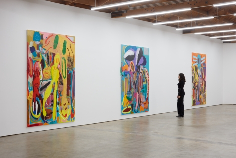 Installation View of "Abstraktes Bild Nr. 4710d", " Wer hat Dr. Pfeffer erfunden?,", and "Ernst Ludwig Kirchner Hinrichtung im Jahre 1999" with Woman standing next to it for scale