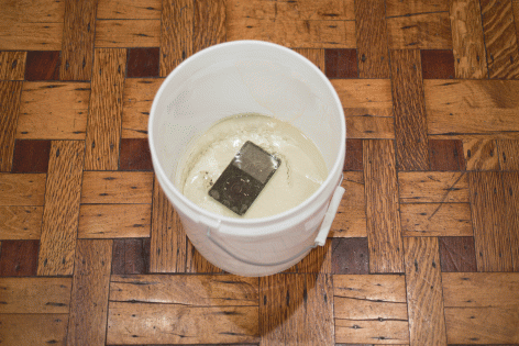 Luca Dellaverson "Fight This Generation", 2015 Epoxy resin, iPod Classic, industrial bucket 9-1/2 x 9-1/4 x 9-1/4 inches