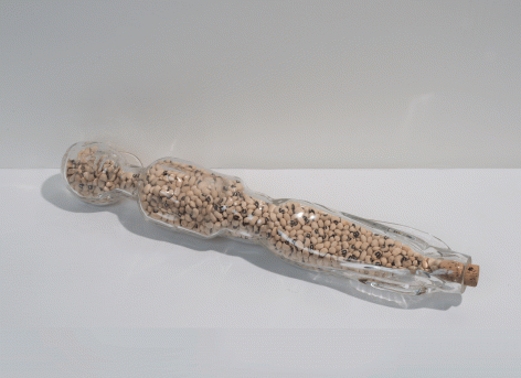 Fred Holland "Woman with 1,000 Eyes", 2015 Cast glass, black eyed peas, and cork 2-1/2 x 17 x 3 inches