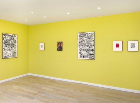 multiple rectangular works in a green room