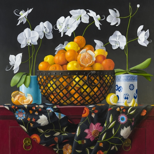 an ornate still life painting of oranges in a metal basket with flowers, vessels, and patterned fabric by James Aponovich