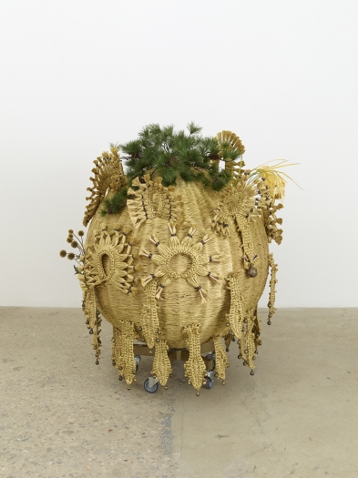 Haegue Yang The Intermediate – Inceptive Sphere, 2016 Artificial straw, steel stand, powder coating, artificial plants, artificial fruits, plastic twine, Indian bells, casters 53 1/8 x 45 1/4 x 45 1/4 inches (135 x 115 x 115 cm)