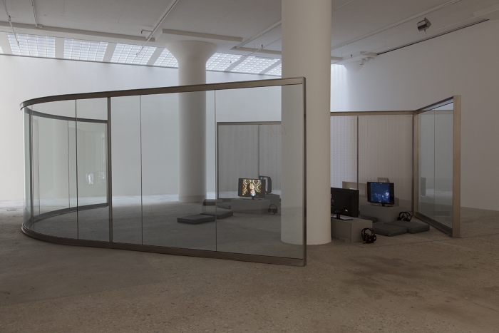 Design for Showing Rock Videos, 2014, Reflective glass, stainless steel, 93 x 227 x 283 inches