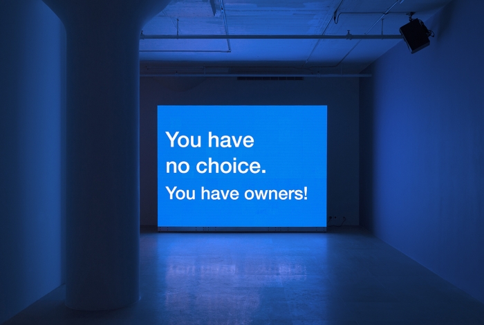 Tony Cokes Evil 35: Carlin / Owners, 2012 Digital video, Color, Stereo,