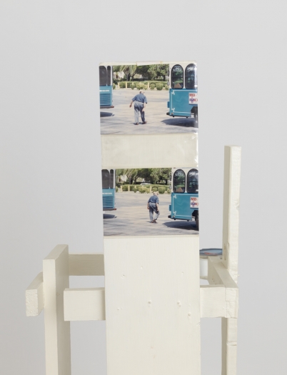 Rachel Harrison Oil of Olay, 1997 (detail) Wood, acrylic, Virgin Atlantic water, wheels, plastic sleeve, and chromogenic prints 54 x 13 x 13 inches (137.2 x 33 x 33 cm)