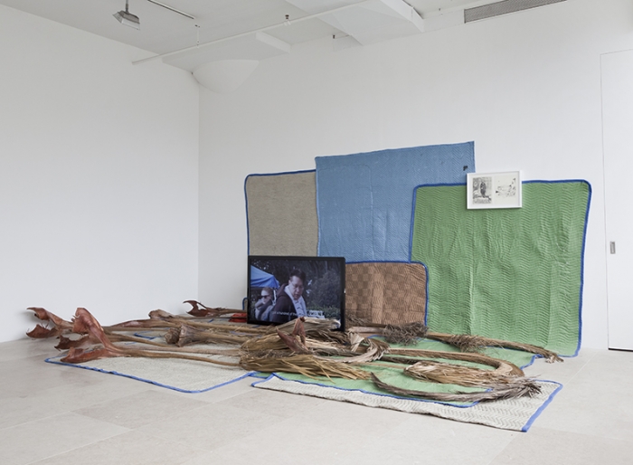 FREAK OUT, Koki Tanaka, Someones junk is someone elses treasure, 2011, Digital video projections w/ sound, palm fronds, moving blankets, money box, framed drawing, dimensions variable