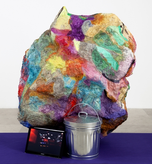 Rachel Harrison Hoarders, 2012 Wood; polystyrene; chicken wire; cement; cardboard; acrylic; metal pail; flat screen monitor; wireless headphones; runway carpet; and Hoarders Video, digital video, color, sound, 10:39 min (2012) Overall dimensions variable Sculpture: 61 x 47 x 45 inches (154.9 x 119.4 x 114.3 cm)