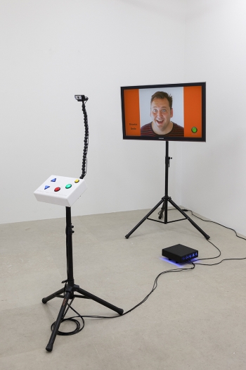 Momoyo Torimitsu Smile :-), Wear it Like a Costume!, 2017 TV (flatscreen), tripods, custom electronics, computer, acrylic Dimensions variable