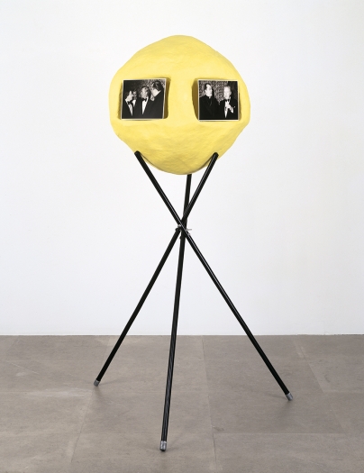 Rachel Harrison 2 a.m. 2nd Ave., 1996 Wood; papier-mâché; acrylic; three broomsticks; and five laminated black-and-white photographs of Johnny Carson, Carroll O’Connor and a priest 73 x 41 x 29 inches (185.4 x 104.1 x 73.7 cm)