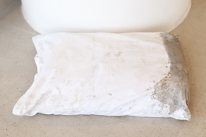 Gerry Bibby, Concrete Dreams, 2016, Fabric, concrete, concrete bag, 5 x 22 x 16 3/4 inches (12.7 x 55.9 x 42.5 cm)