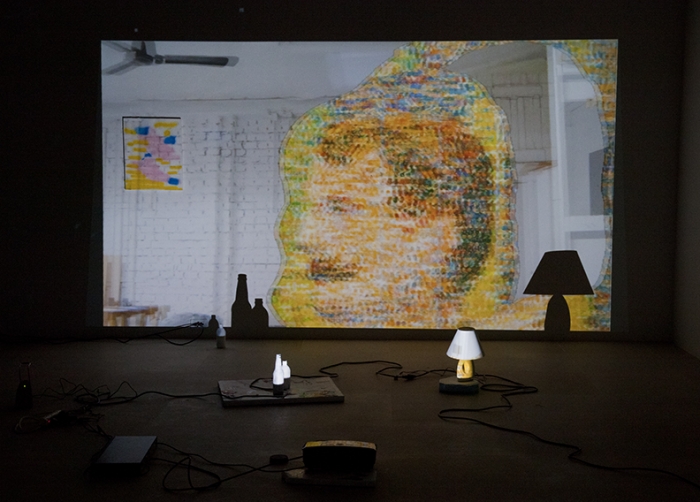 The Story of Painting, 2012, 3-D video slideshow with 3-D glasses, two acrylic-on-canvas paintings, computer speaker, lamp, painted bottles and painted foam pieces, 19:01 min, color, sound, Dimensions variable