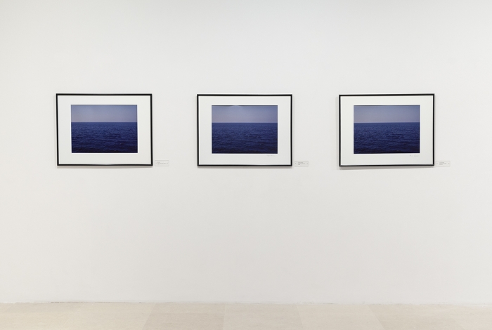 Claire Burrus Sujet à discrétion (Subject to discretion), 1985 3 framed color photographs and 3 title cards with text: "ANONYME la mer en méditerranée (vue générale) multiple", "PHILIPPE THOMAS autoportrait (vue de l'esprit) multiple", "CLAIRE BURRUS autoportrait (vue de l'ésprit) pièce unique" Photographs: 25 5/8 x 31 1/2 inches (65 x 80 cm) each Title cards: 1 5/8 x 4 3/4 inches (4 x 12 cm) each