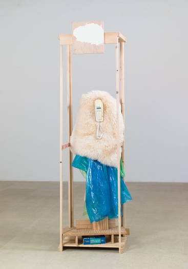 Rachel Harrison Caller ID, 2014 Wood, enamel, plastic raincoats, sheepskin, telephone book, and telephone 88 1/4 x 27 1/2 x 19 3/4 inches (224.2 x 69.9 x 50.2 cm)