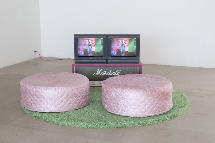 Sue de Beer Disappear Here, 2004 2-channel video installation with 2 DVDs, DVD synchronizer, 2 beanbag chairs, wood, silkscreen, shag pile rug 96 x 96 inches (243.8 x 243.8 cm), 5 mins.