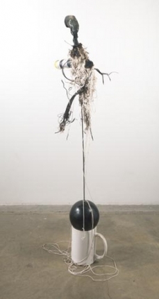 How many cups does it take to make a continuum suspend: stress, 2011. Large coffee cup, bowling ball, steel rod, melted tennis ball, border bottle, string, scrap tire tread, Rousseau, small coffee cup, 69 1/2 x 28 x 20 inches (176.5 x 71.1 x 50.8 cm). MP 24