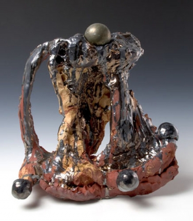 Pyrite Fourchette, 2007. Ceramic, bronze sphere, formica pedestal. Sculpture - 16 x 17.5 x 5 inches (40.6 x 44.5 x 12.7 cm); pedestal: 40 x 25 x 17 inches (101.6 x 63.5 x 43.2 cm). MP 38