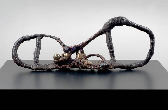Figure Maker with Sphere, 2007. Ceramic, formica pedestal, sculpture: 18 x 46 inches (45.7 x 116.8 cm); pedestal: 24 x 40 x 64 inches (61 x 101.6 x 162.6 cm). MP 29