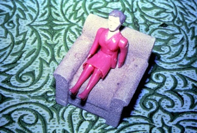 Laurie Simmons Purple Woman/Gray Chair/Green Rug, 1978