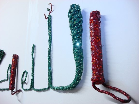 Jaishri Abichandani Allah Hu Akbar 2008 Leather whips, wire, paint, and swarovski crystals 16 x 54.5 in.