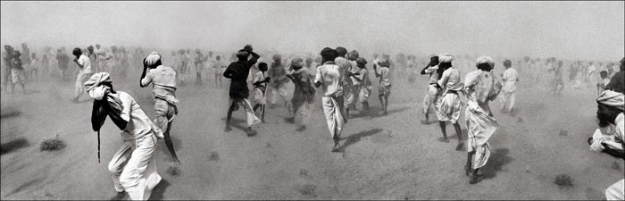 Raghu Rai Dust Storm Created by VIP Helicopter, Rajasthan 1975 Digital print on archival paper 20 x 62 in.