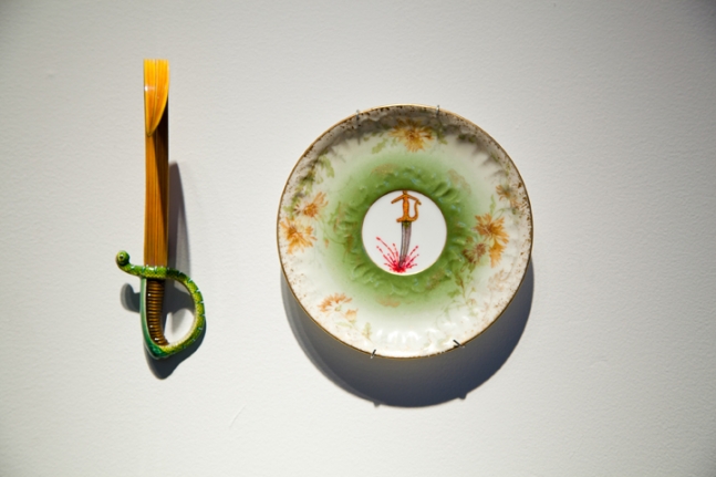 Adeela Suleman THANK YOU FOR YOUR SERVICE 3 2014 Found porcelain plate with enamel paint and hand-painted dagger Plate: 5 x 5 in. / Dagger: 6 x 2 x 4 in.