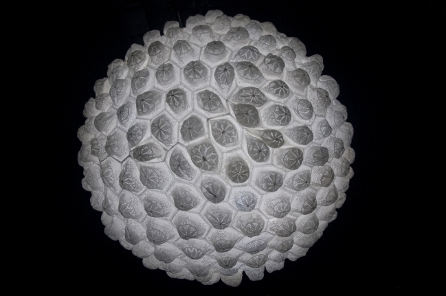 Abdullah M. I. Syed Nurun 'ala Nur (Light Upon Light), 2015 Hand-stiched white crouched taqiyah (skullcaps), LED light, Perspex dome and mirror Dimensions variable