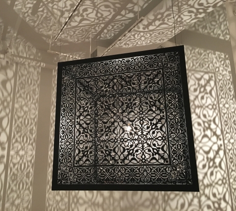 Anila Quayyum Agha Shimmering Mirage, 2016 Laser-cut black steel, wires, and bulb 36 x 36 x 36 in
