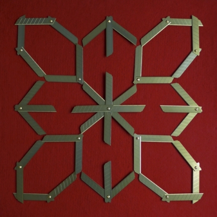 Abdullah M. I. Syed Margin of Error - Rosette on Red (Ed. of 5) 2017 Titanium utility knife blades, brass, stainless steel, felt and tempered hardwood 23 x 23 in.