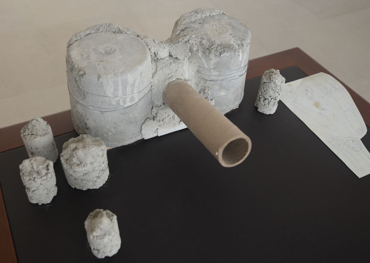 After Artaud: The sexual awkwardness of god, Ass Cannon, 2019, Concrete, cardboard tube, boxes, razors, tacks, matches, mousetrap, corkscrew, office hardware, pubic hair, cow’s blood and collage on table, 36 x 45 x 32 inches (91.4 x 114.3 x 81.3 cm)