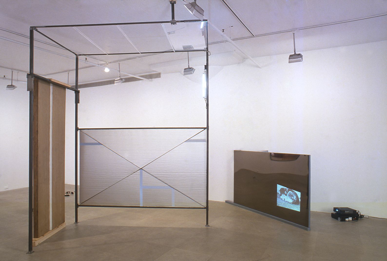 Heidie Gianotti, When Suburban Living Was Good, 2001, Steel, plexi, insulation, caulking, vinyl, super 8 film, Dimensions variable