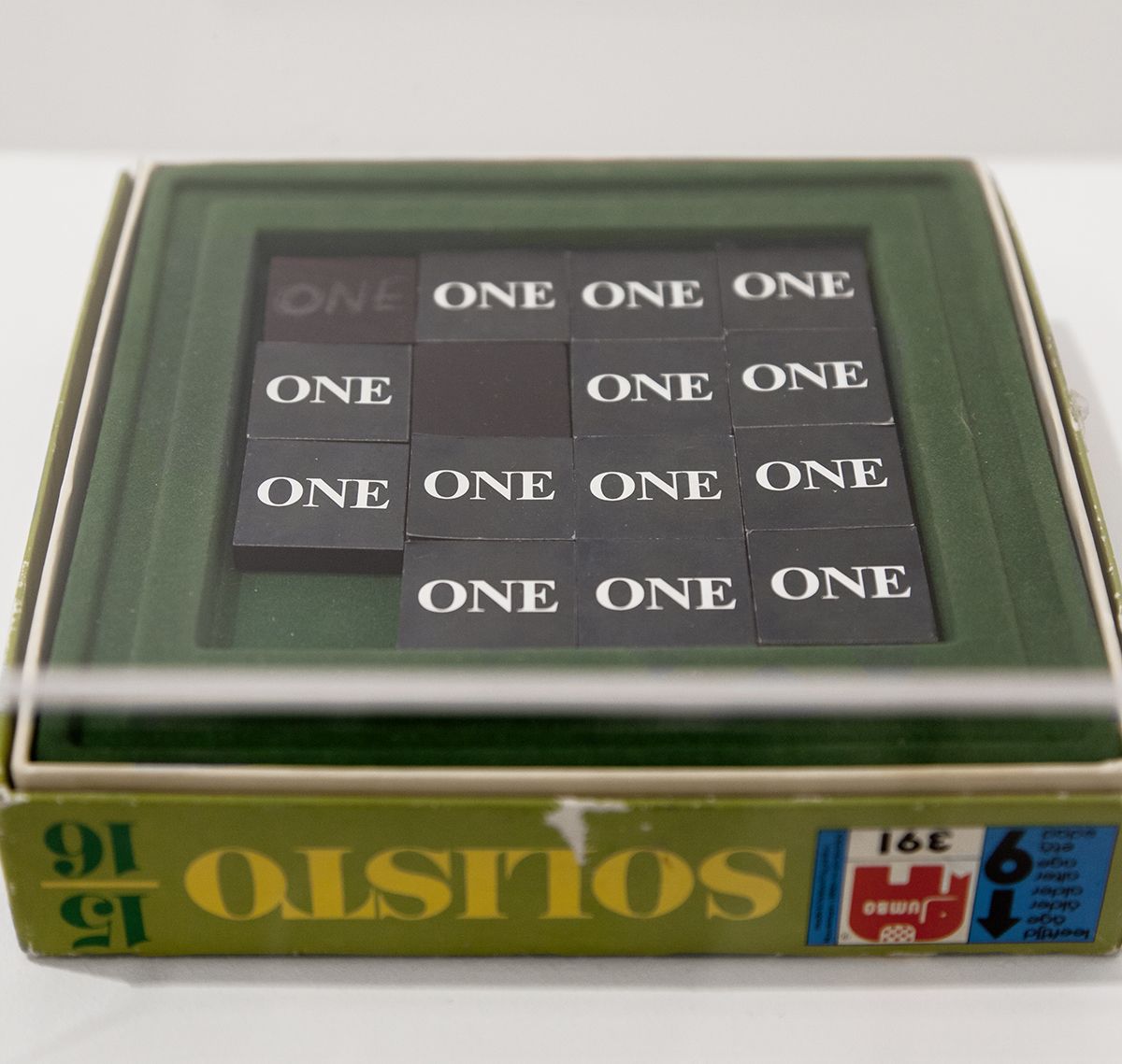 Dan Graham One, 1966 15 wooden puzzle pieces with container and cardboard box Puzzle: 1 1/2 x 1 1/2 inches (3.8 x 3.8 cm) each Box: 1 3/4 x 7 x 7 inches (4.4 x 17.8 x 17.8 cm)