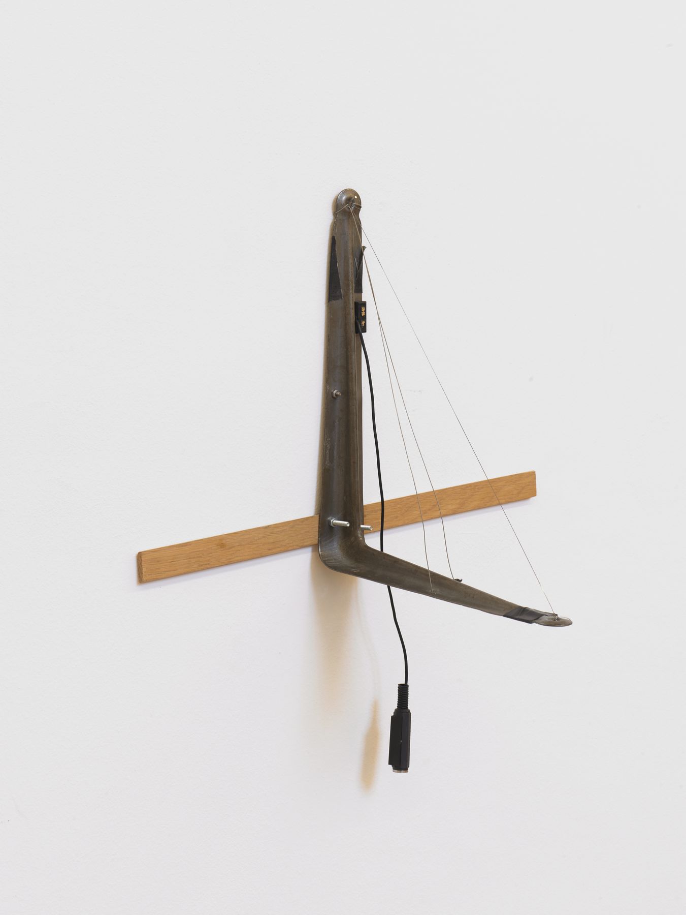Tony Conrad L-bracket with Three Strings, 2002 Bowed wire (hand stretched), L-bracket, electric pickup 13. 3/4 x 15 3/4 x 10 1/4 inches 35 x 40 x 26 cm
