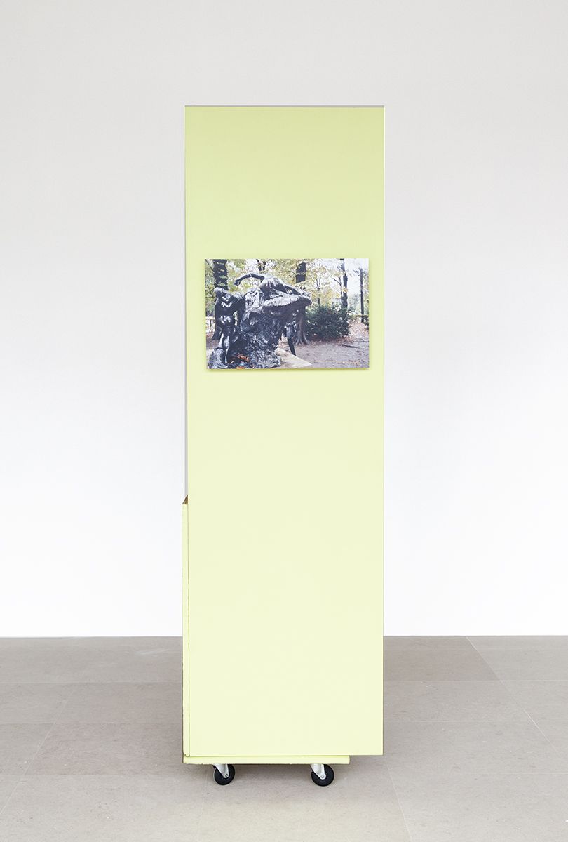 Rachel Harrison, The Fourth Shade, 2000, Wood, polystyrene, cement, acrylic, cardboard, hollow core door, lamp, wheels, and chromogenic print, 85 x 32 x 24 inches
