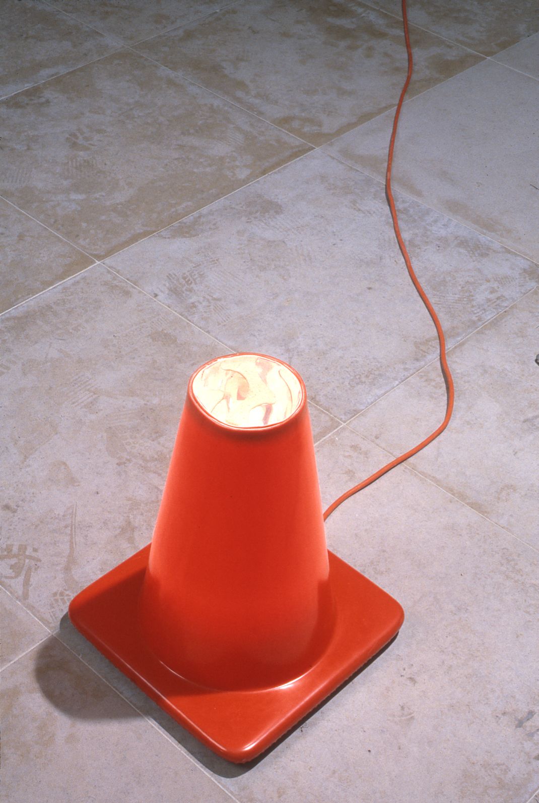 Jeff Nelson, Point, 1995 traffic cone, mylar, light source, extension cord Dimensions variable