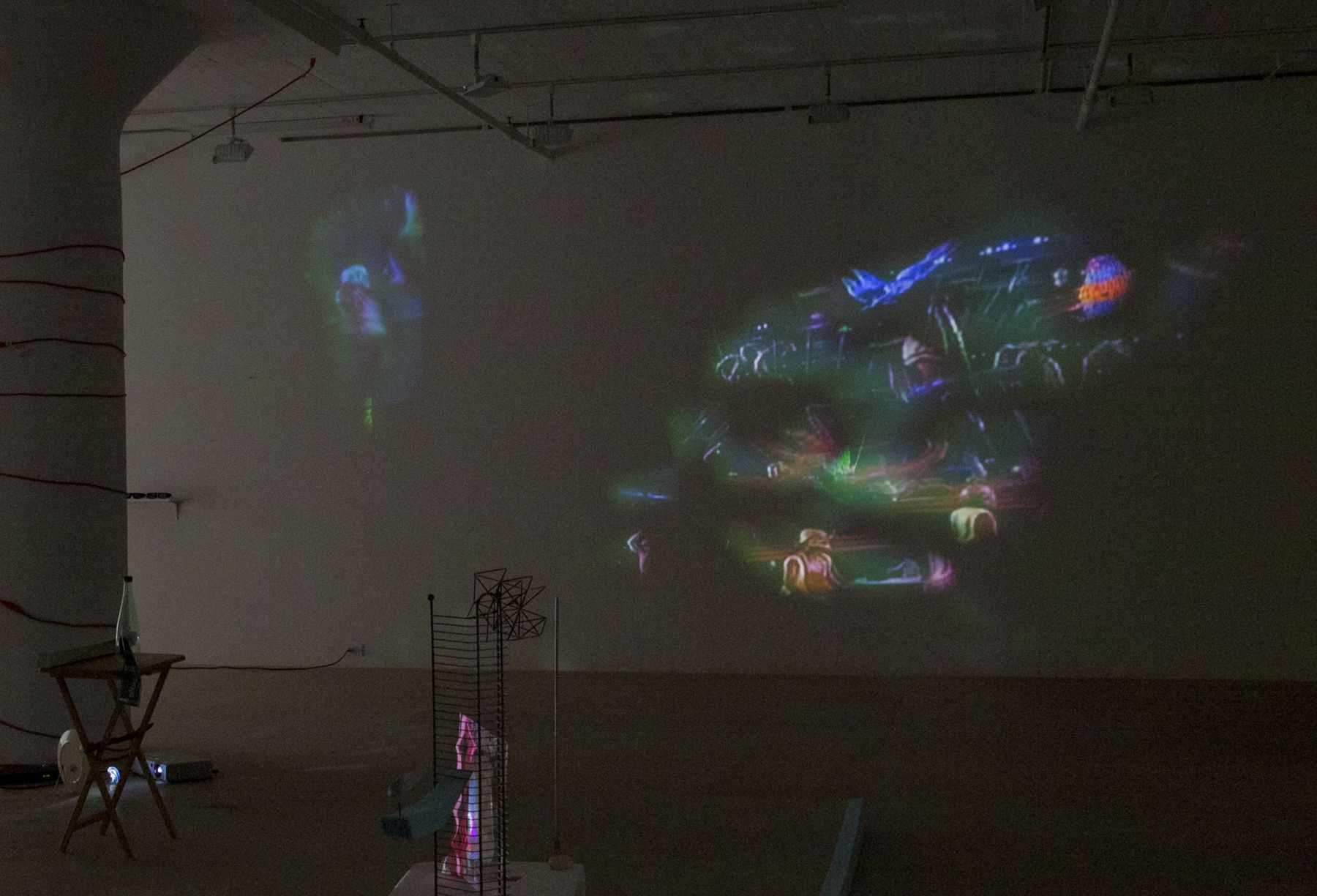 Trisha Baga, Cloud Atlas, 2012, Single-channel video installation with plate, broken mirror, grout, mirrored plexiglass and clay, 22:54 minutes, Dimensions variable