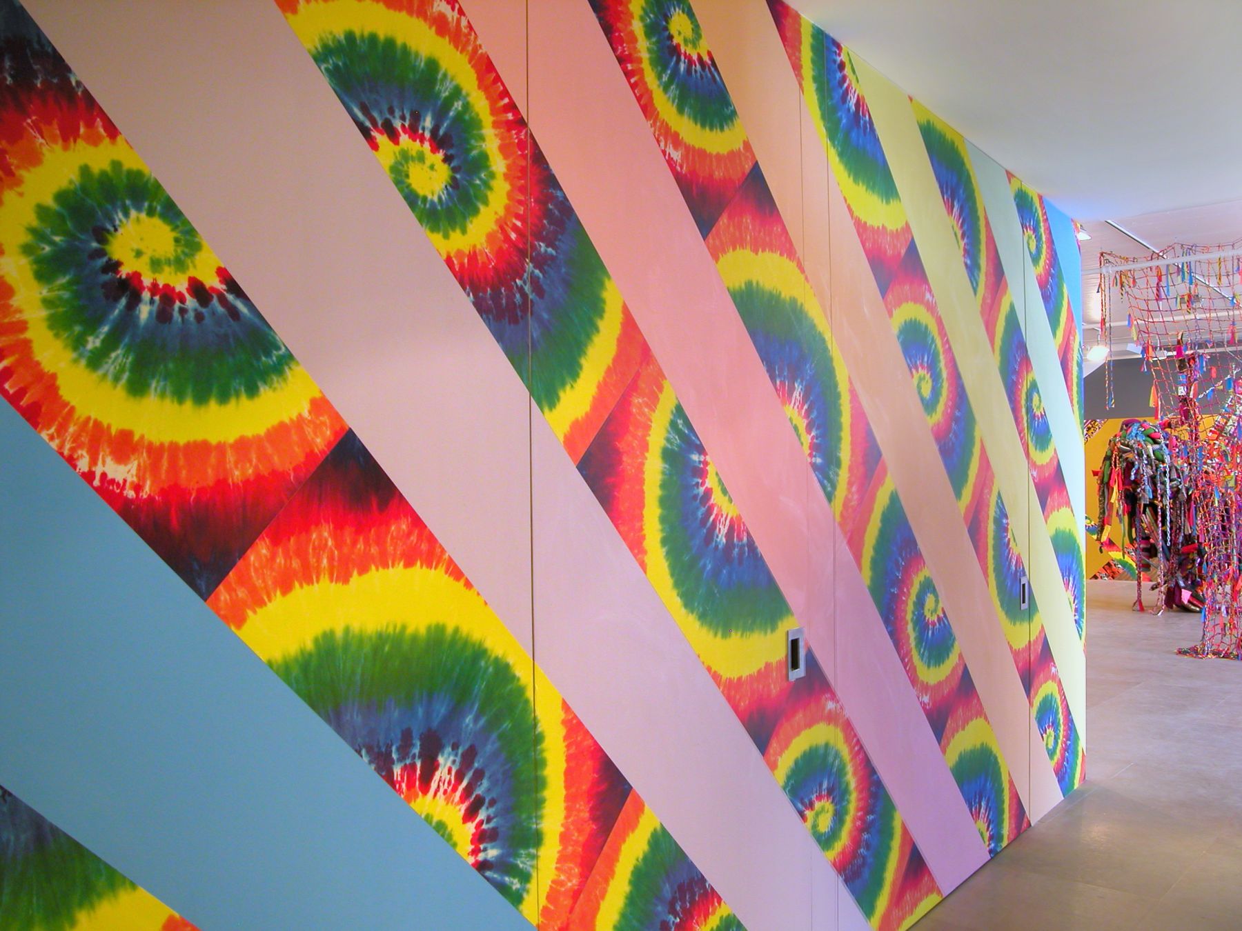 Jim Drain, I Would Gnaw on My Hand (Hallway), 2007, tie-dye and leopard print wallpaper, latex paint, Dimensions variable, Installation view, Greene Naftali, New York, 2007