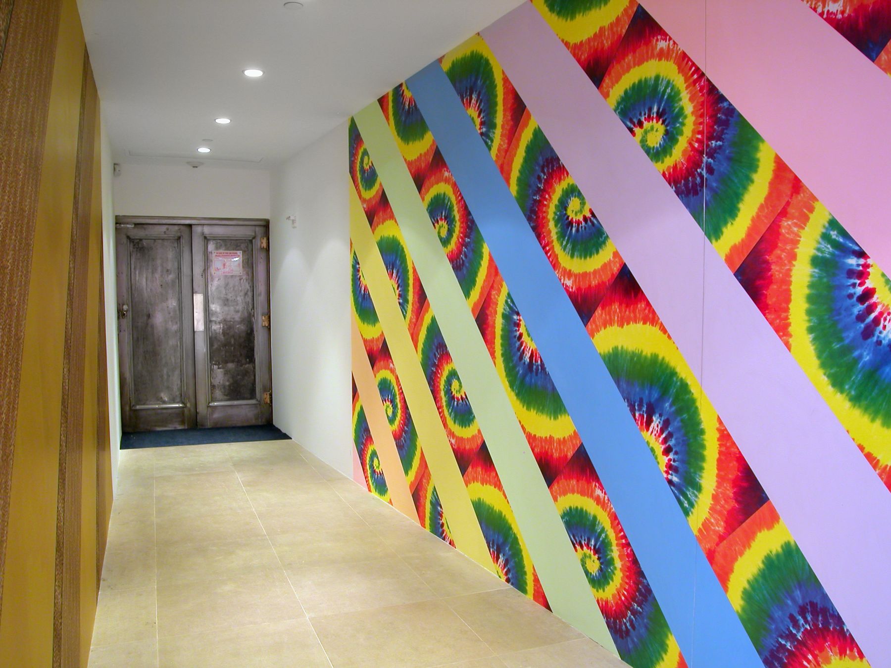 Jim Drain, I Would Gnaw on My Hand (Hallway), 2007, tie-dye and leopard print wallpaper, latex paint, Dimensions variable
