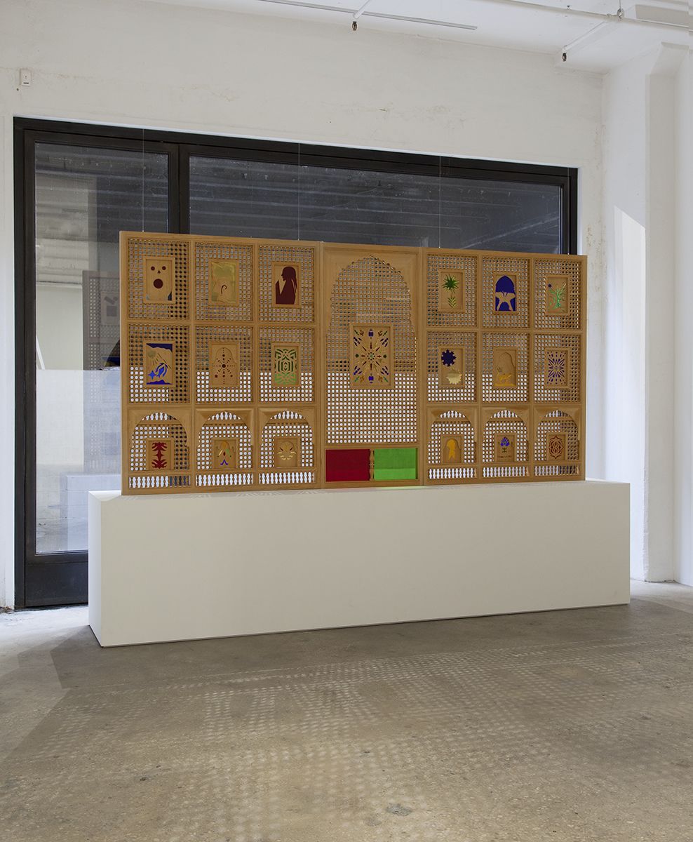 Katharina Wulff Tifaout ntitrit, 2014 Mashrabiya, Cedar wood, Iraqi glass Overall Dimensions: 69 1/4 x 141 11/16 x 2 1/8 (175.8 x 359.8 x 5.3 cm) Left Panel: 69 1/4 x 55 1/16 x 2 1/8 (175.8 x 139.8 x 5.3 cm) Center Panel: 69 3/16 x 31 1/2 x 2 1/8 (175.7 x 80 x 5.3 cm) Right Panel: 69 1/4 x 55 1/4 x 2 1/8 (175.8 x 140.3 x 5.3 cm)