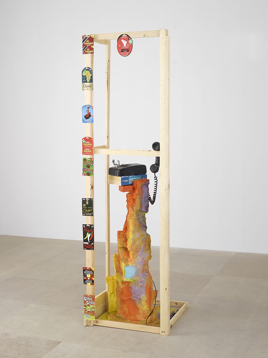 Rachel Harrison We Mean Business!, 2013 Wood, polystyrene, cement, acrylic, telephone, telephone book, prepaid calling cards, and thumbtacks 82 x 24 1/2 x 24 1/2 inches (208.3 x 62.2 x 62.2 cm)