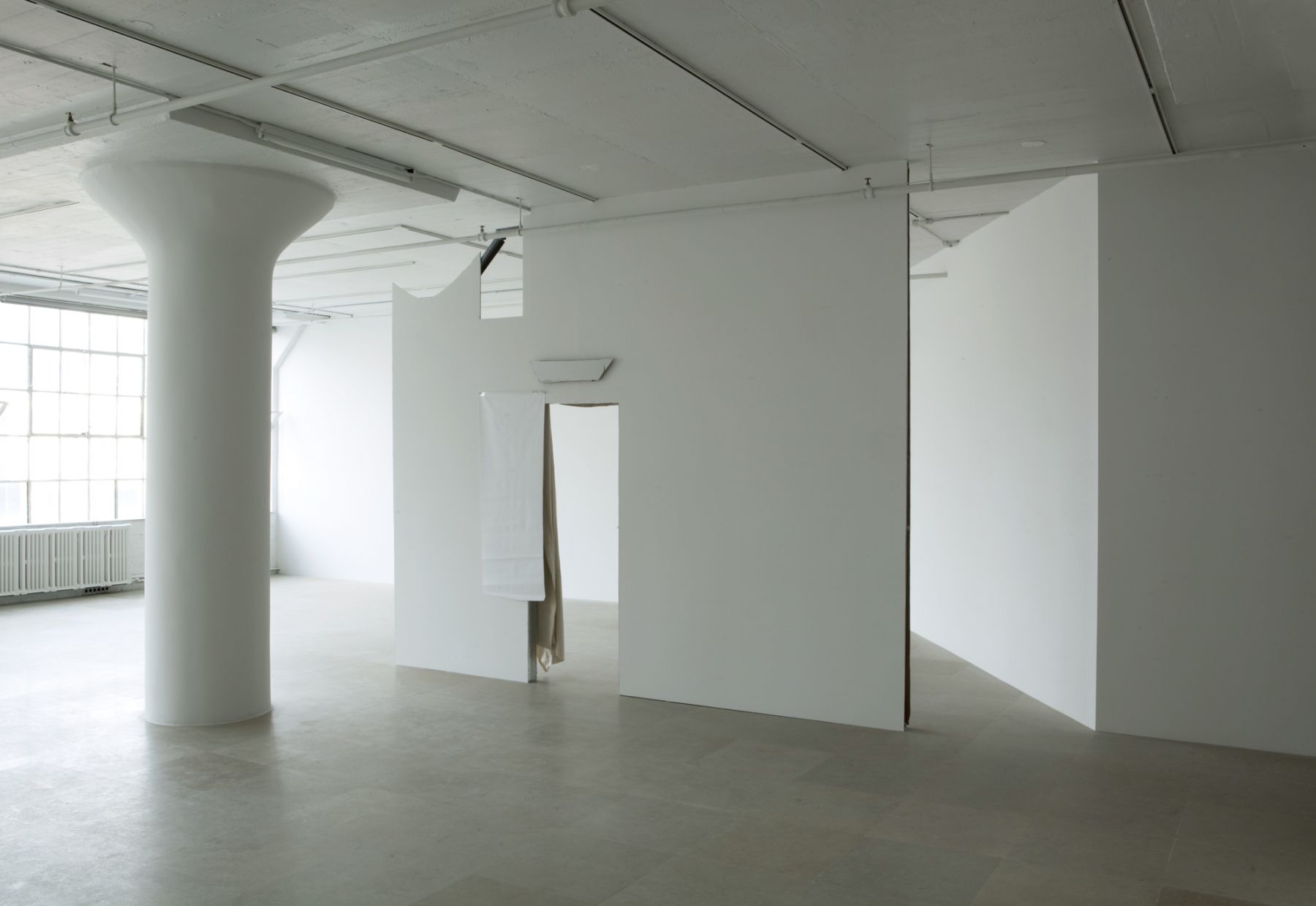 Gedi Sibony The Cutters, 2007 / 2010 Sheetrock wall, paint, hollow core door fragment, vinyl, canvas drop cloth, metallic tape 137 x 164 x 13 inches 348 x 416.6 x 33 cm